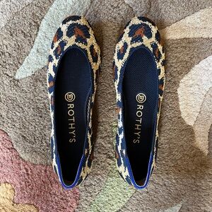 Rothy's Black and Cream Flats with Animal Print